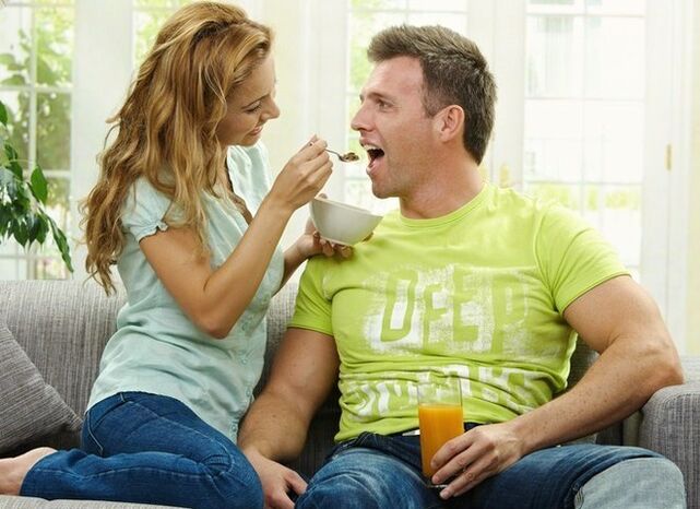 Woman feeds man products to increase potency